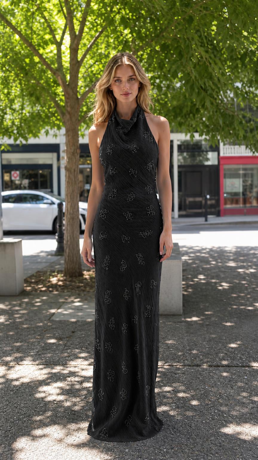 Front view of black halter neck beaded maxi dress