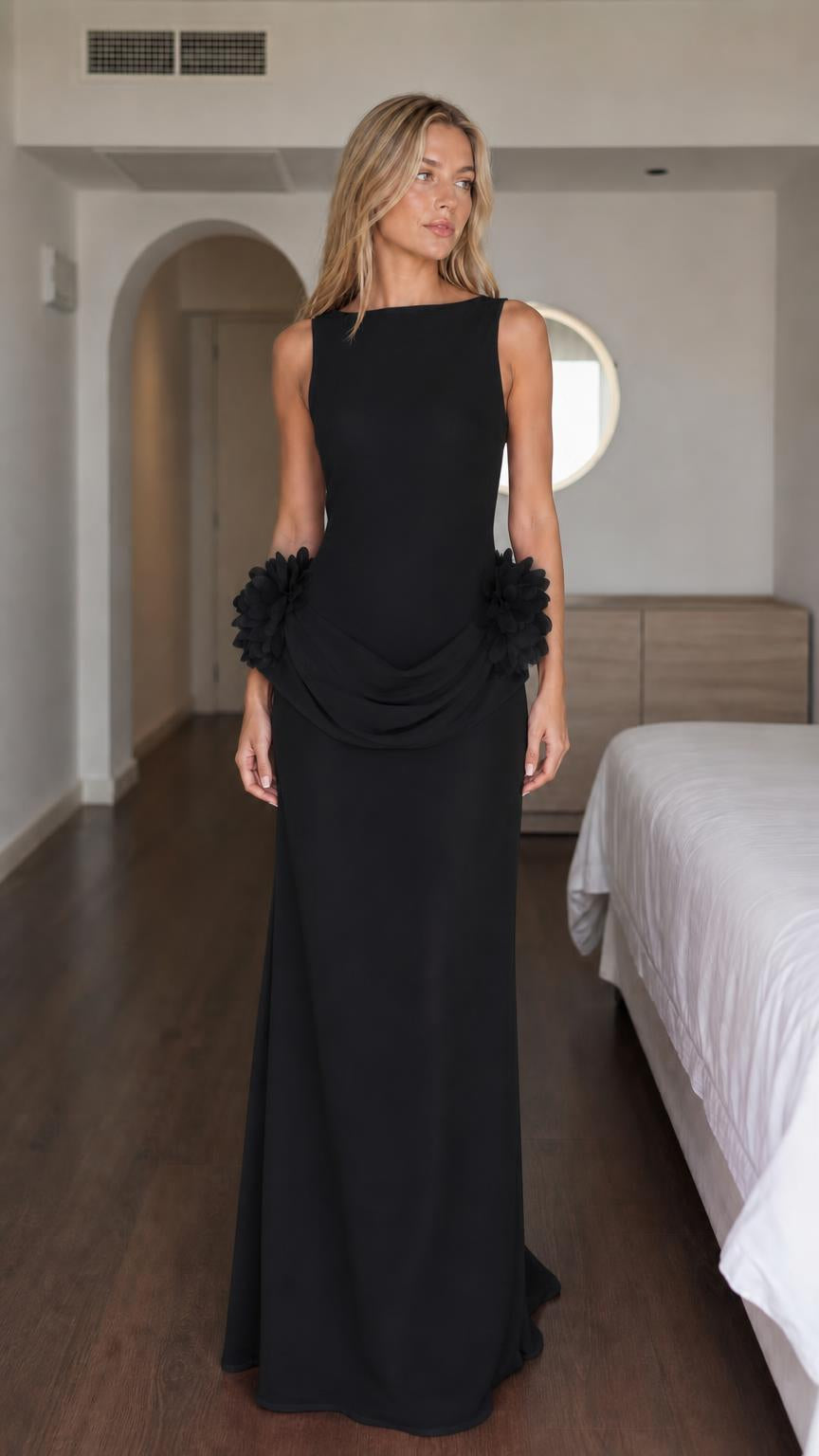 Woman wearing black formal maxi dress with floral details