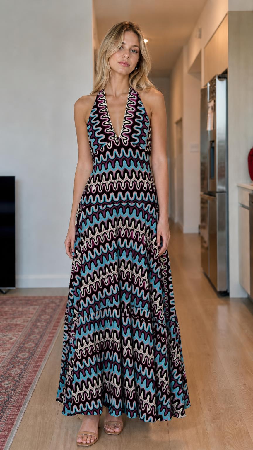 Model wearing black multi wave pattern halter maxi dress