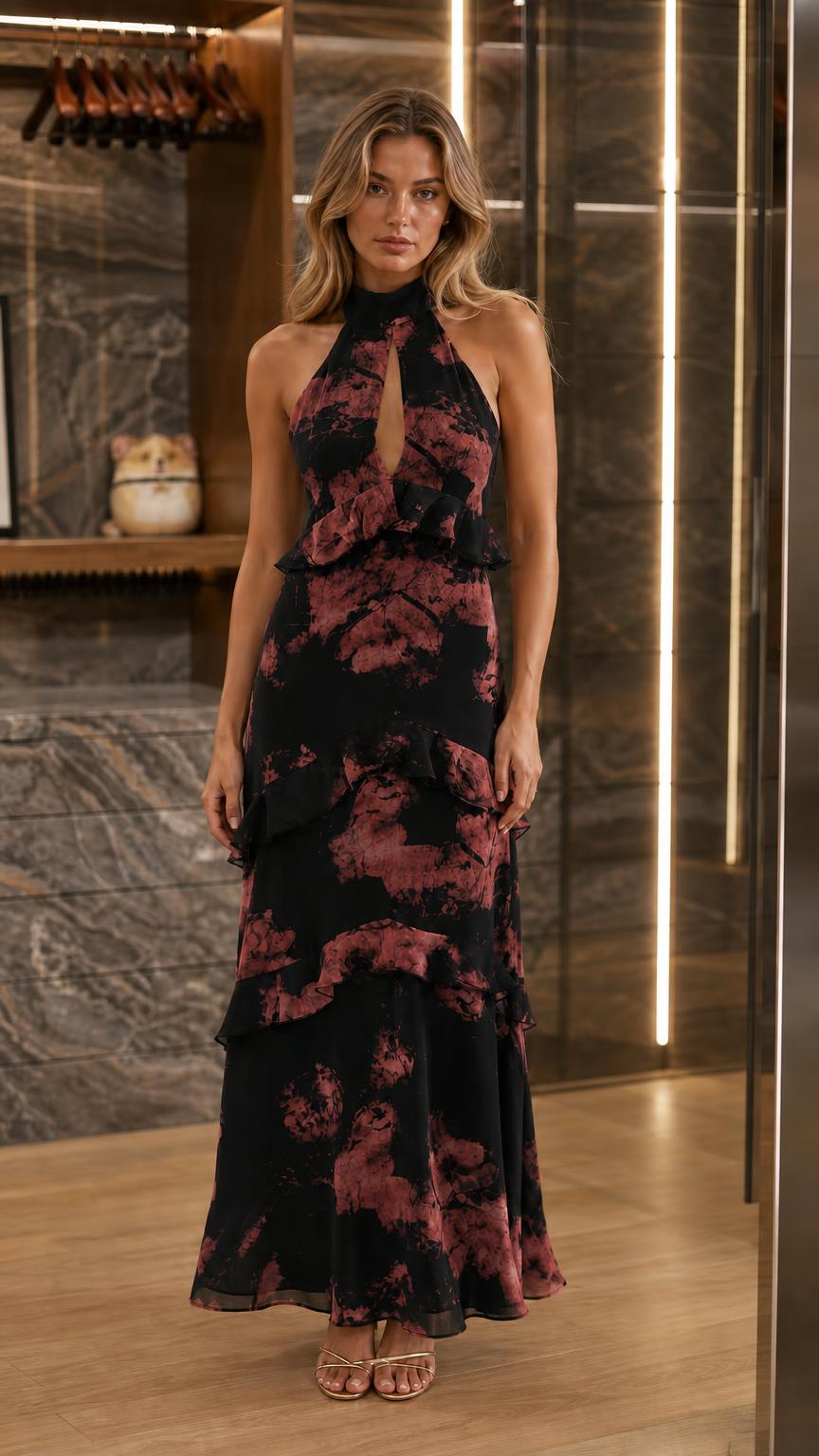 Front view of woman wearing black halter neck tiered ruffle maxi dress