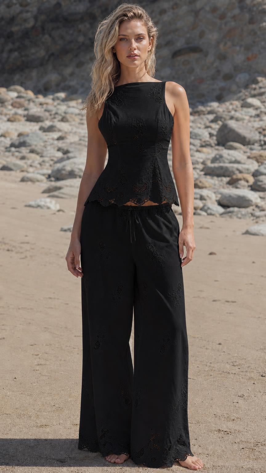 Woman wearing black embroidered two-piece set on the beach