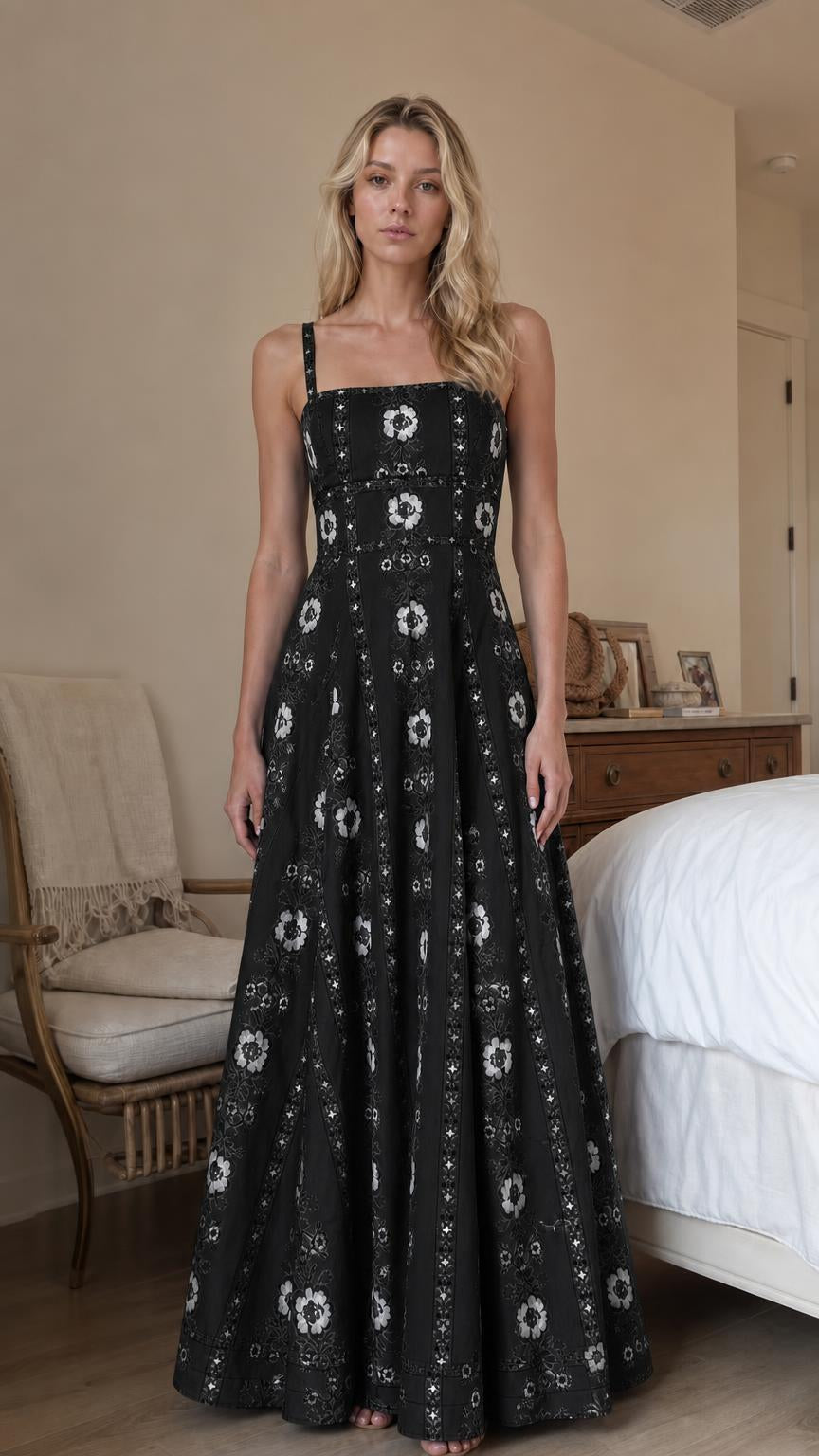 Woman wearing black floral print square neck maxi dress