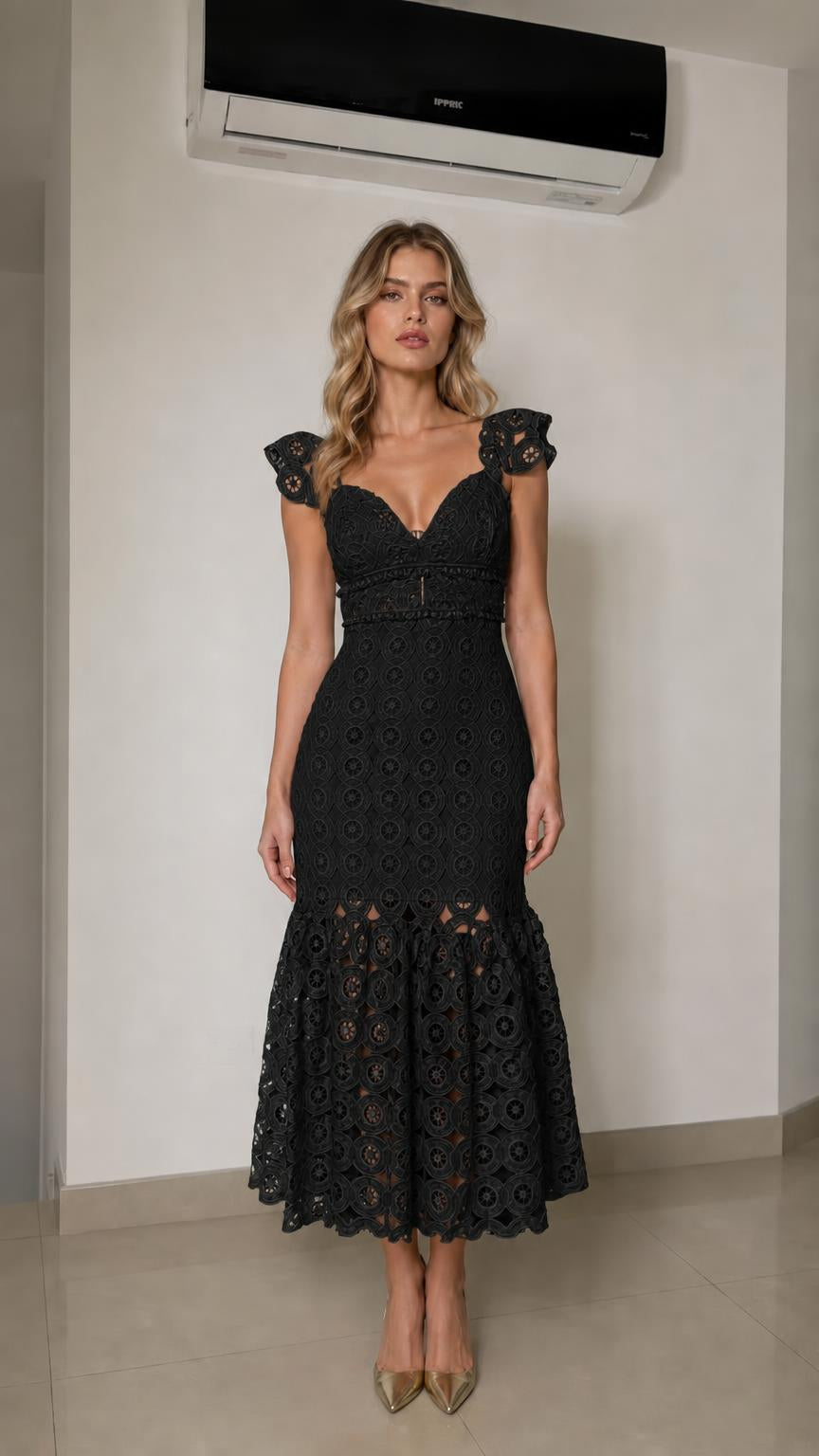 Front view of woman wearing black lace mermaid midi dress