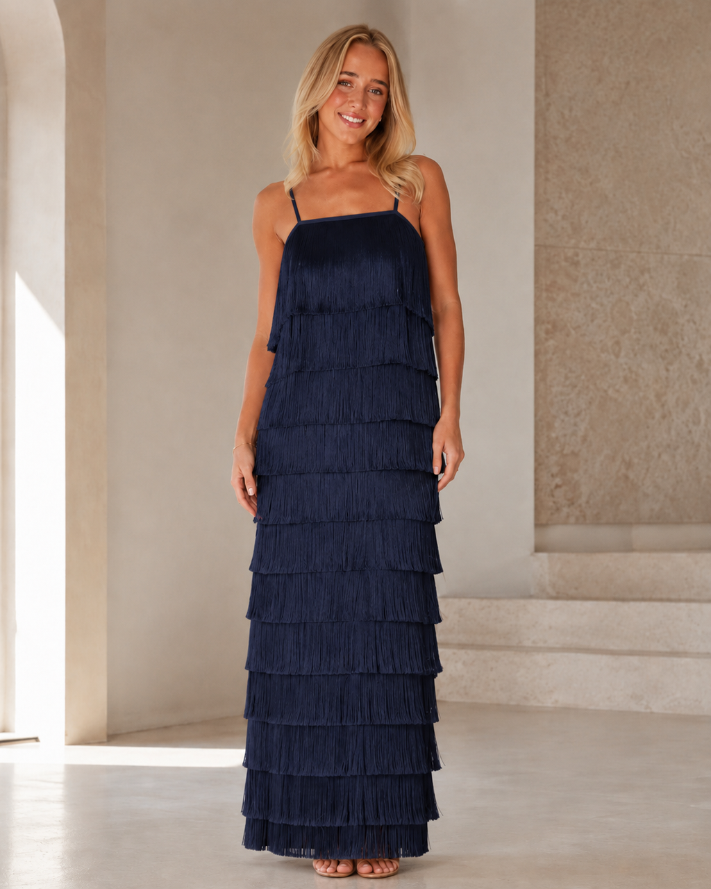 Full front view of navy tiered fringe maxi dress with layered texture