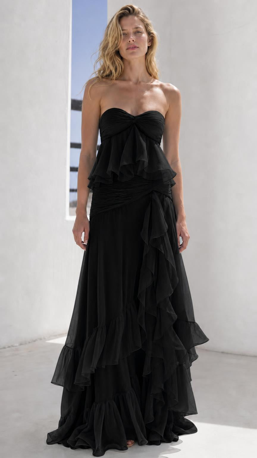 Model wearing black strapless tiered maxi dress