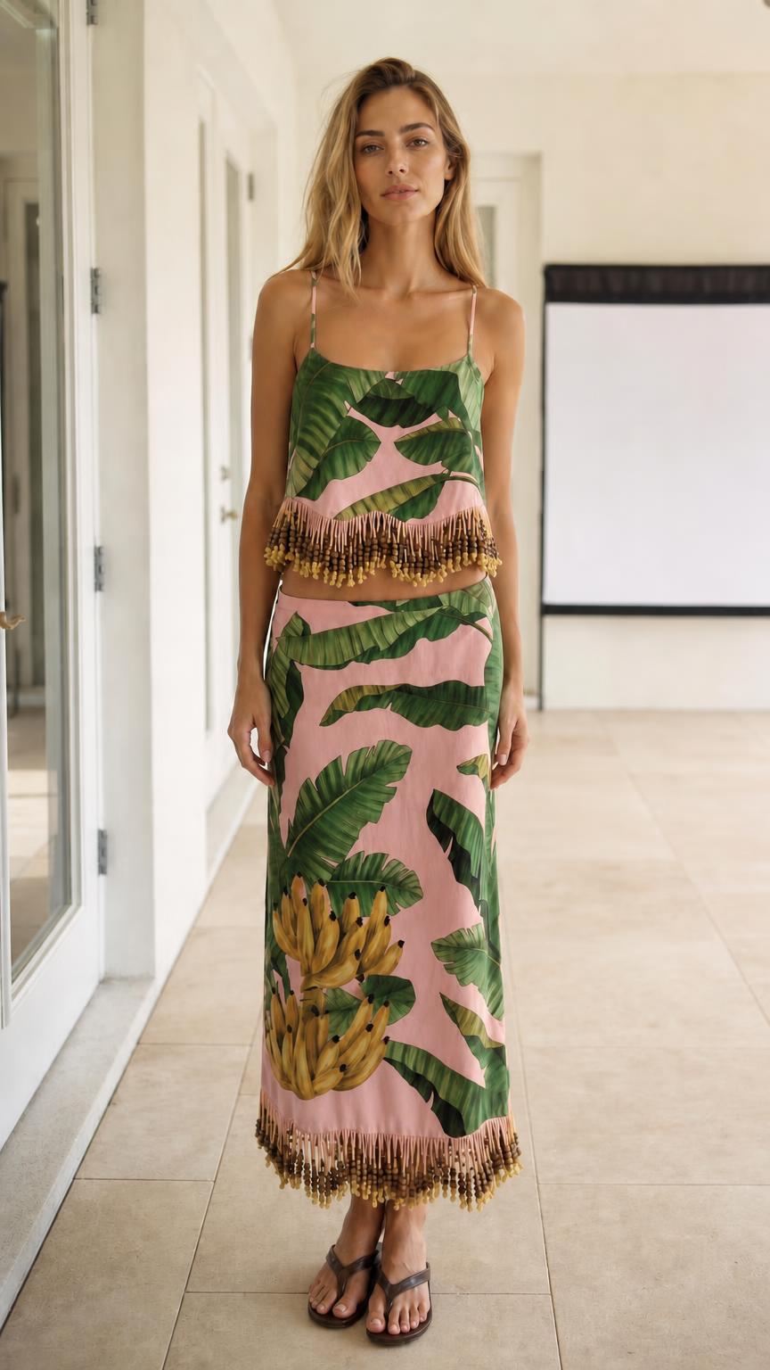 Model wearing pink color variant of the tropical leaf print two-piece set