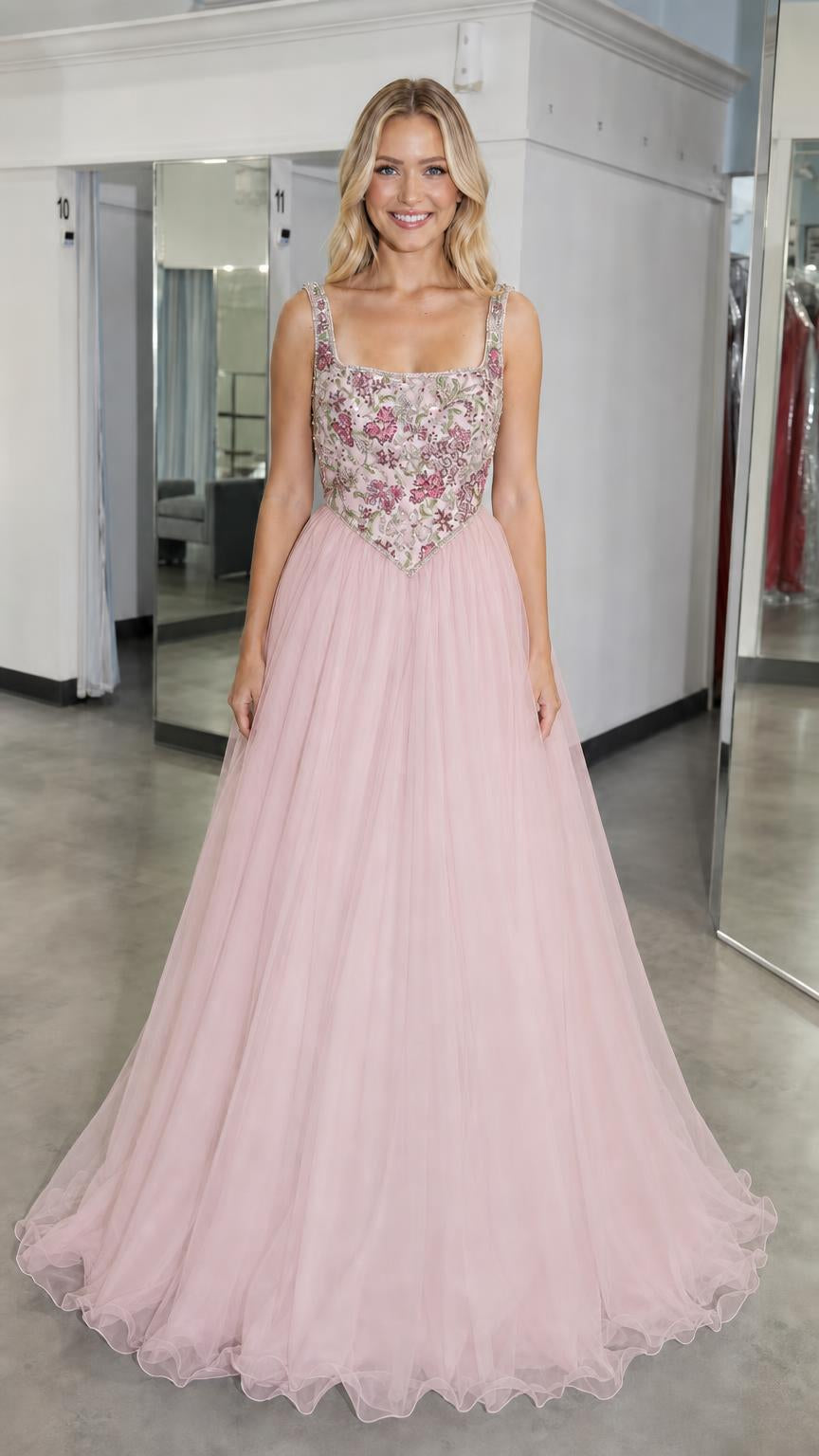 Front view of pink embroidered bodice tulle ball gown