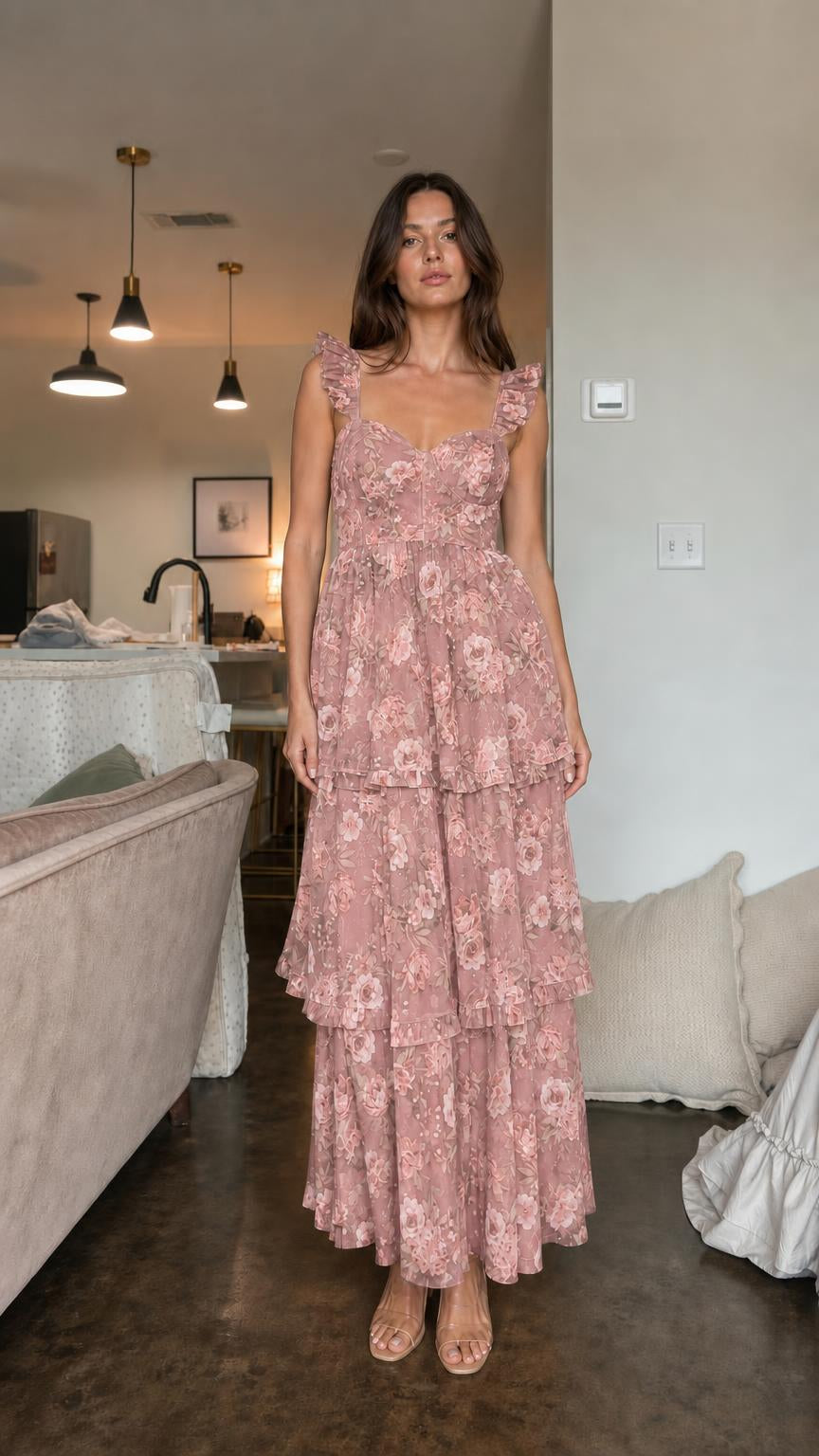 Front view of model wearing pink floral ruffle tiered maxi dress