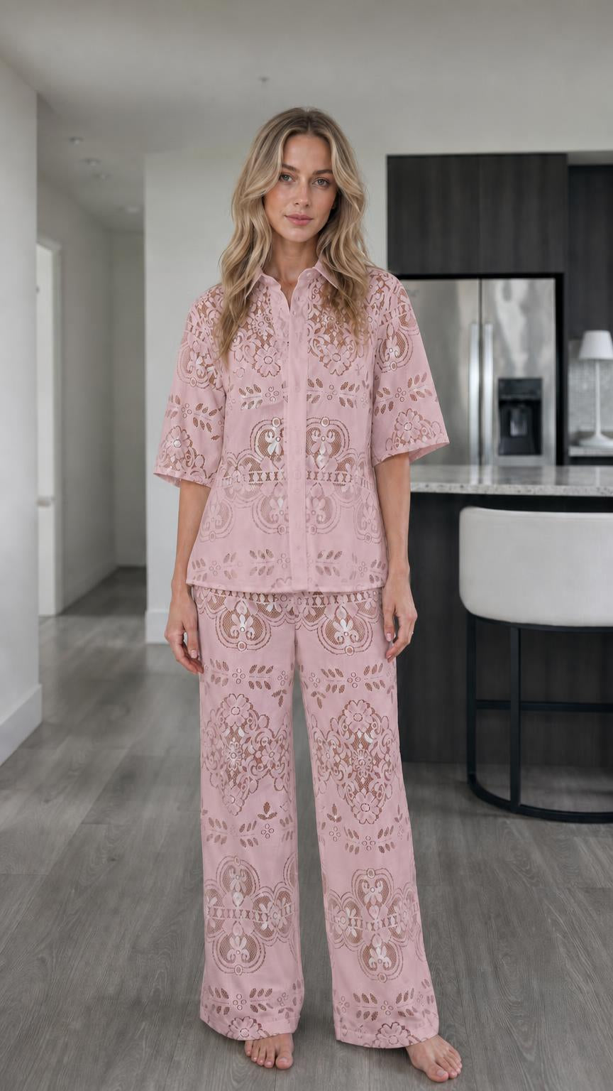 Woman wearing pink floral lace two-piece matching set