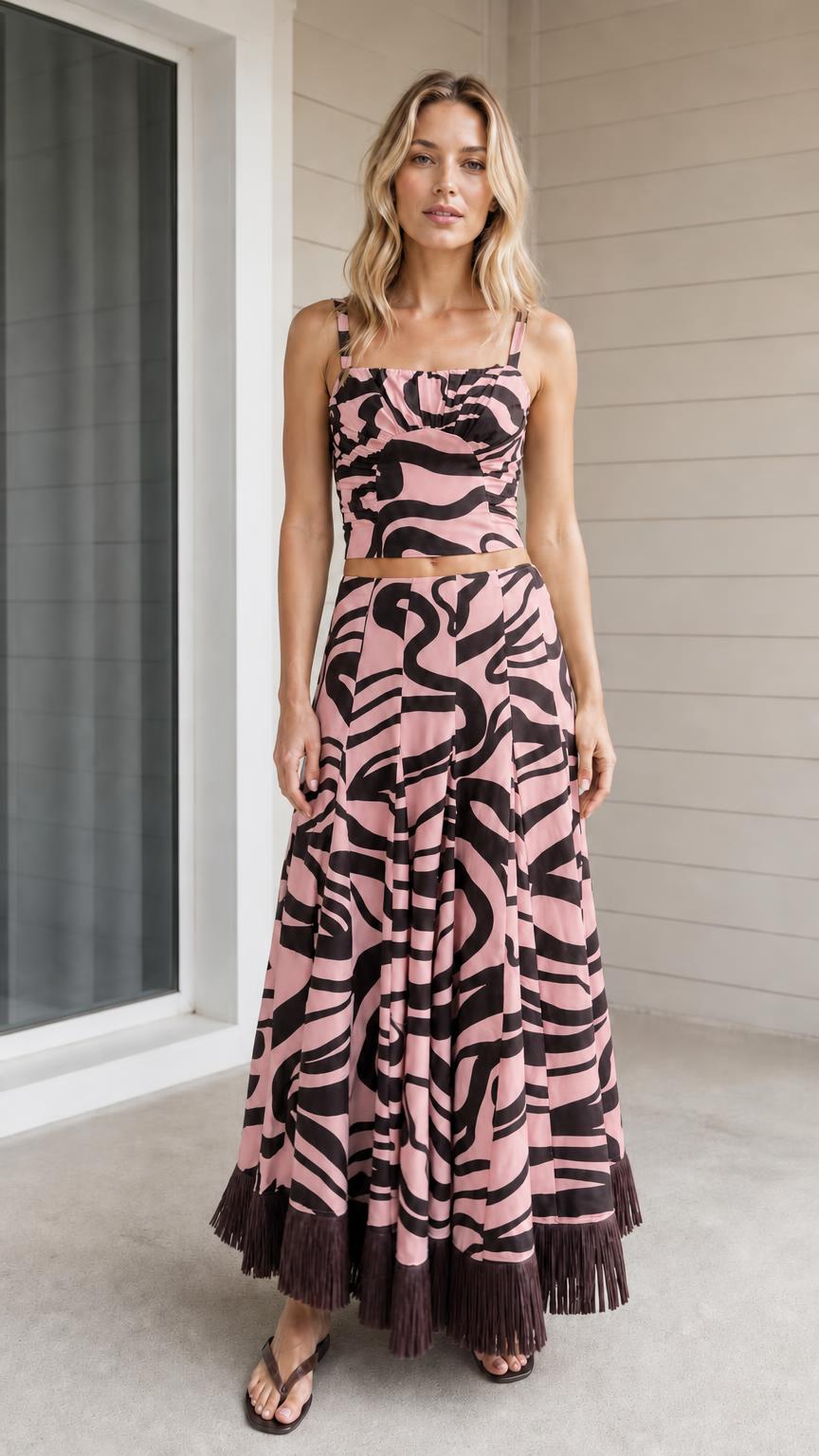 Model wearing pink zebra print crop top and maxi skirt set