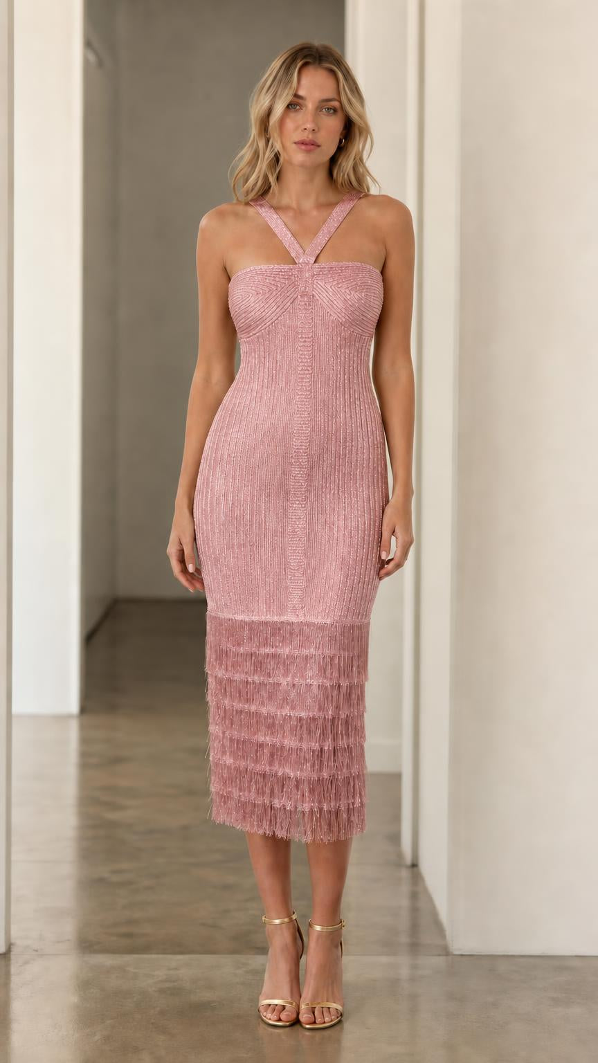 Model wearing pink halter fringe midi dress, front view