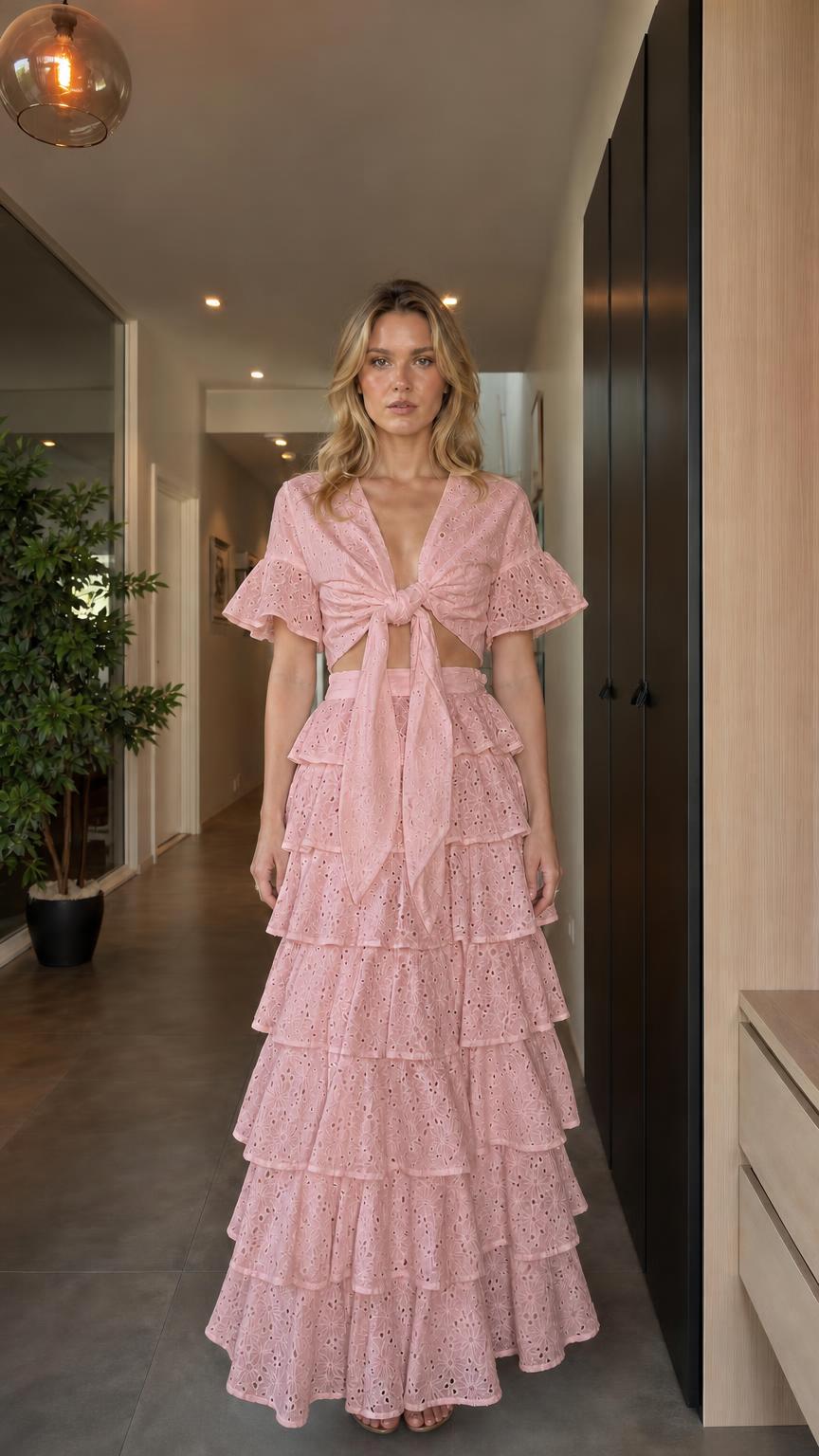 Model wearing pink eyelet embroidered two-piece set