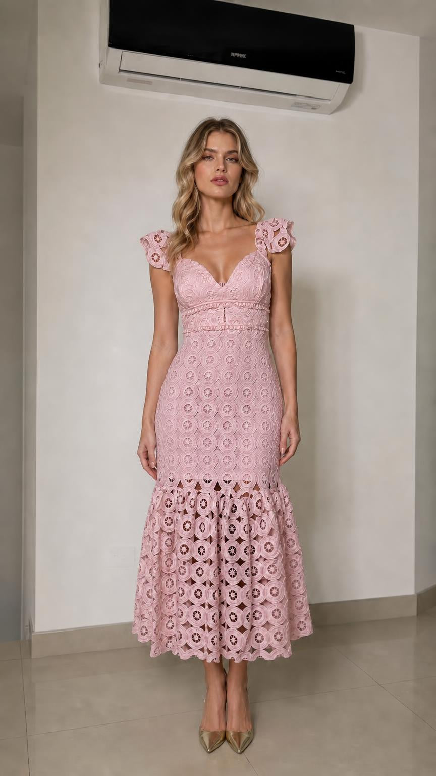 Front view of woman wearing pink lace mermaid midi dress