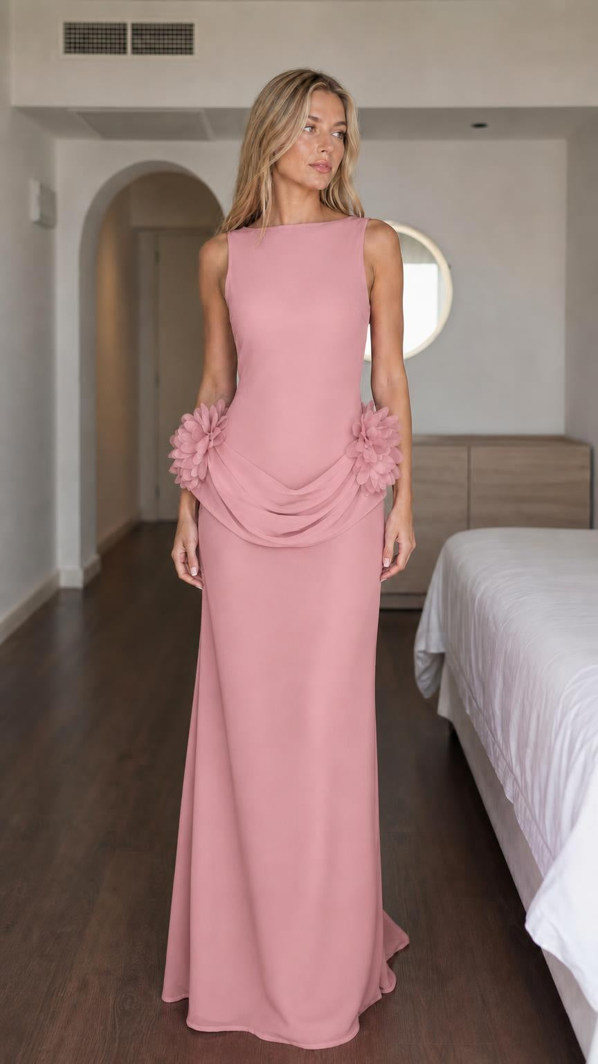 Woman wearing pink formal maxi dress with floral details