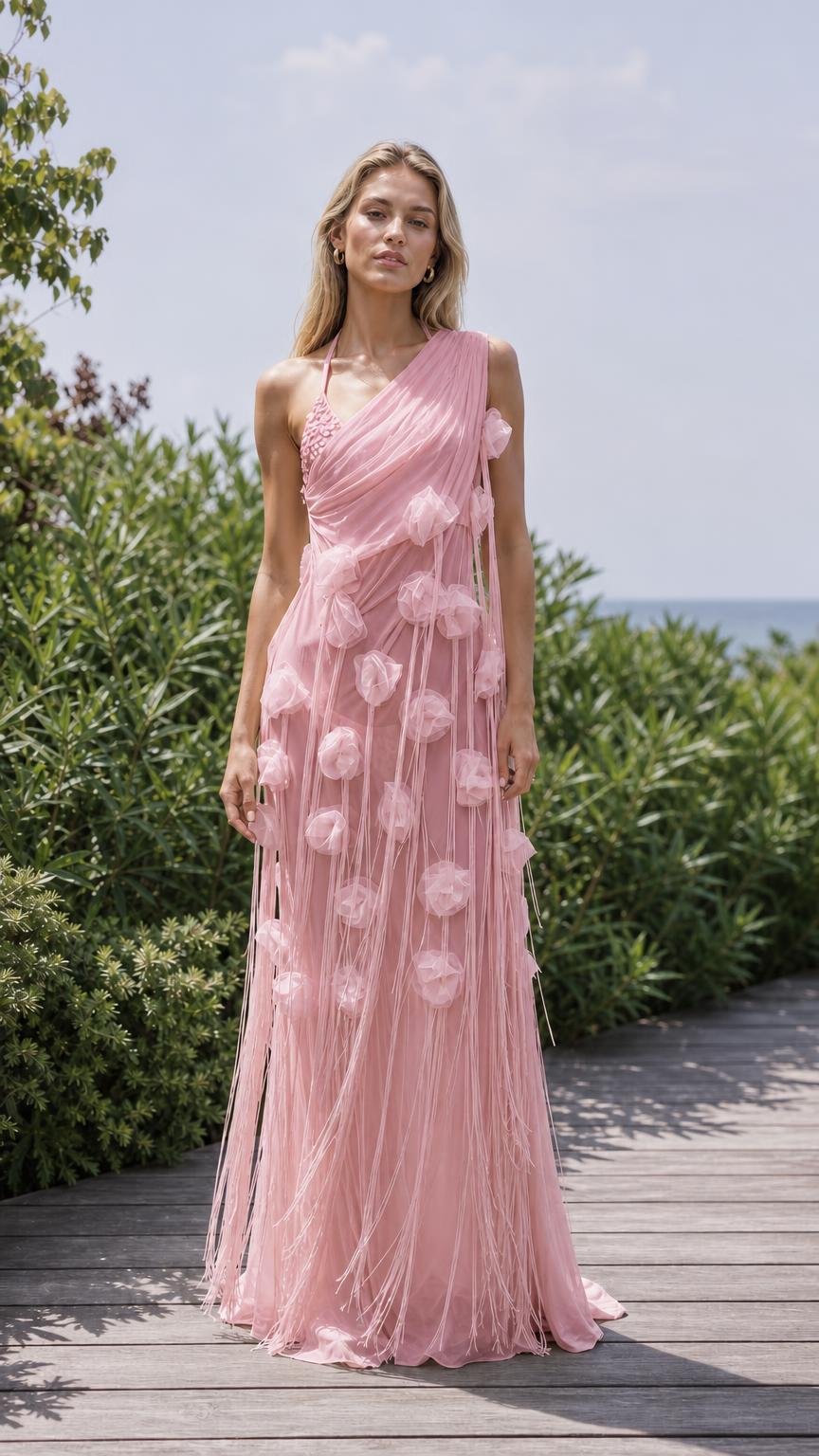 Front view of pink one-shoulder floral applique maxi dress