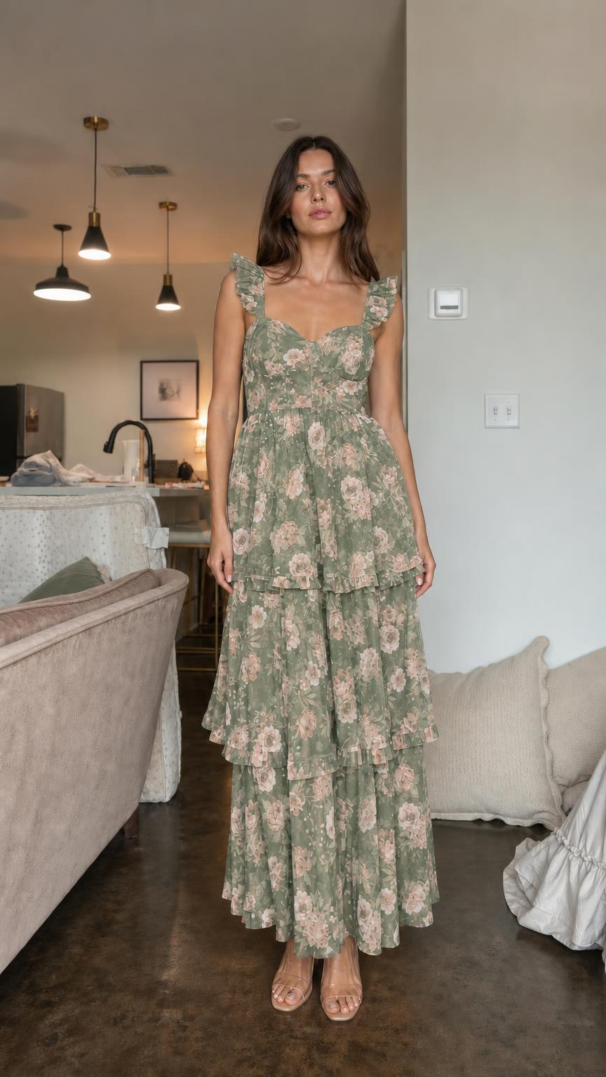 Front view of model wearing green floral ruffle tiered maxi dress
