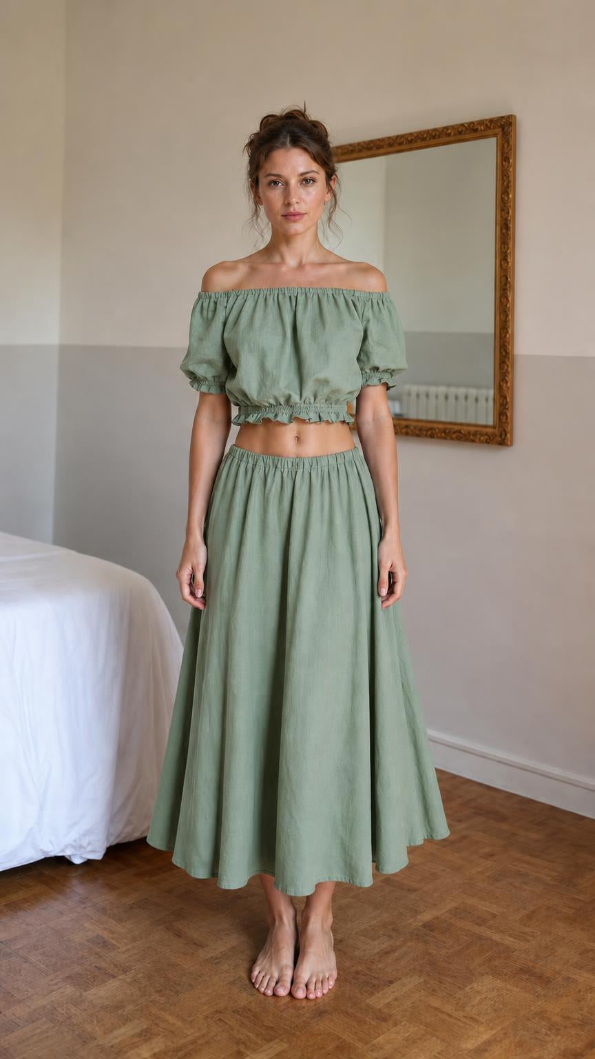 Front view of woman wearing green off-shoulder crop top and midi skirt set