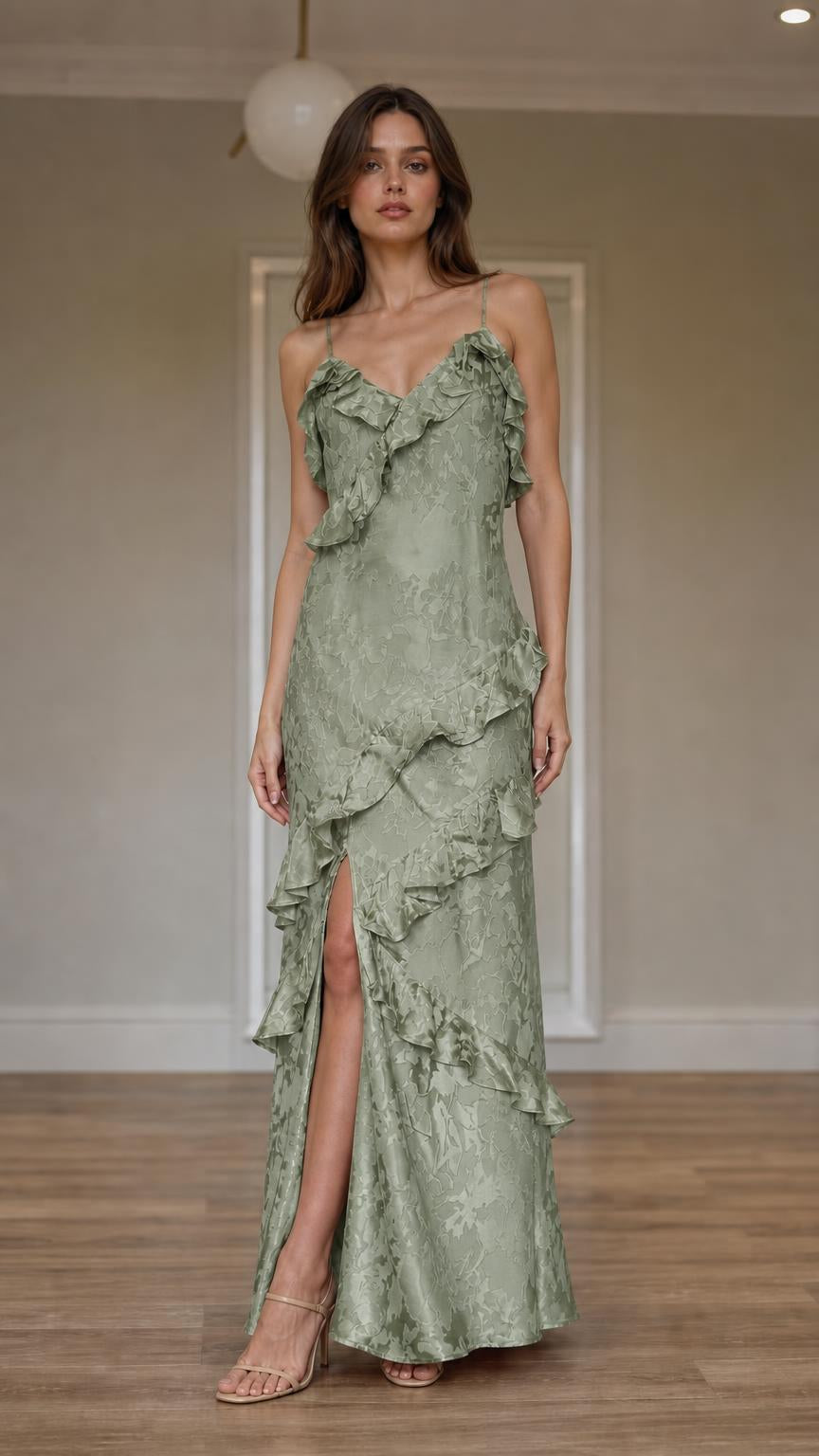 Front view of model wearing sage green ruffled slip maxi dress