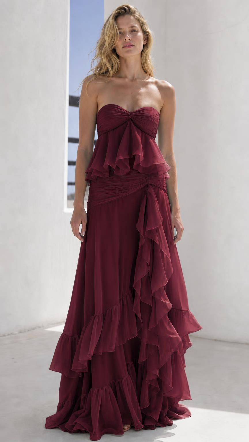 Model wearing burgundy strapless tiered maxi dress