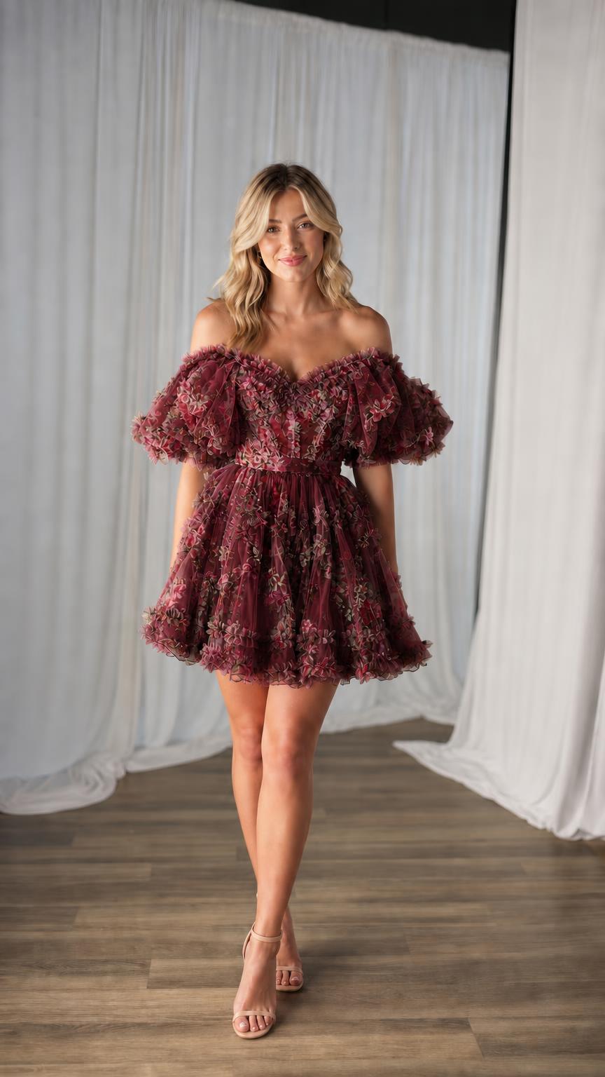 Model wearing burgundy floral tulle mini dress