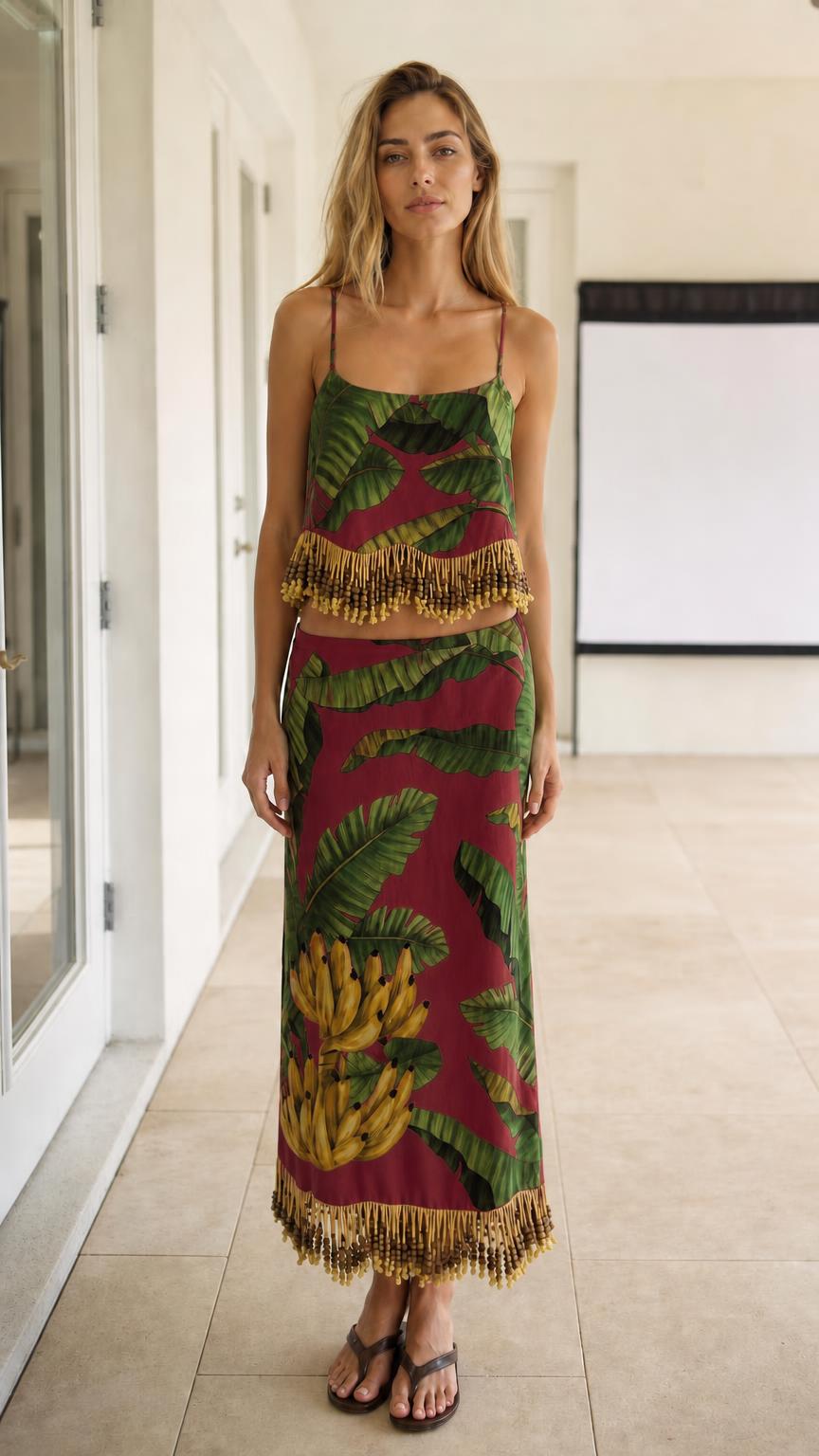 Model wearing burgundy color variant of the tropical leaf print two-piece set