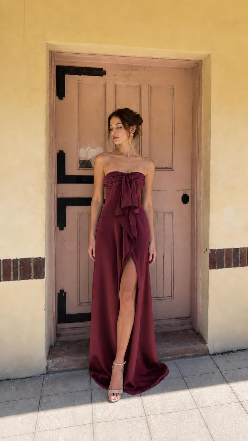 Burgundy strapless evening dress with front bow and high slit