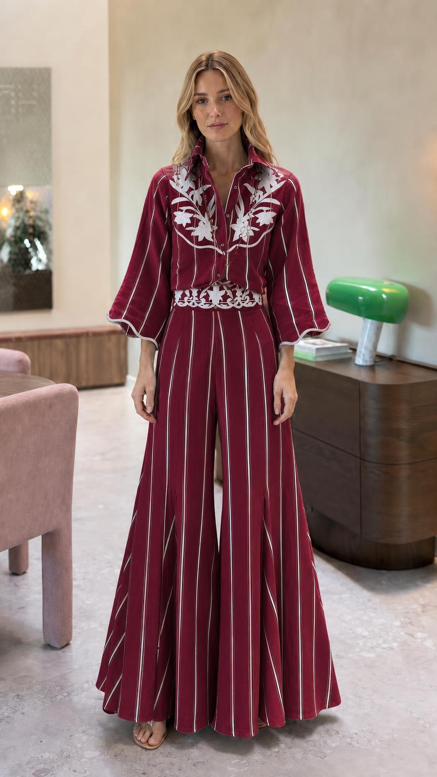 Front view of burgundy striped embroidered wide leg jumpsuit