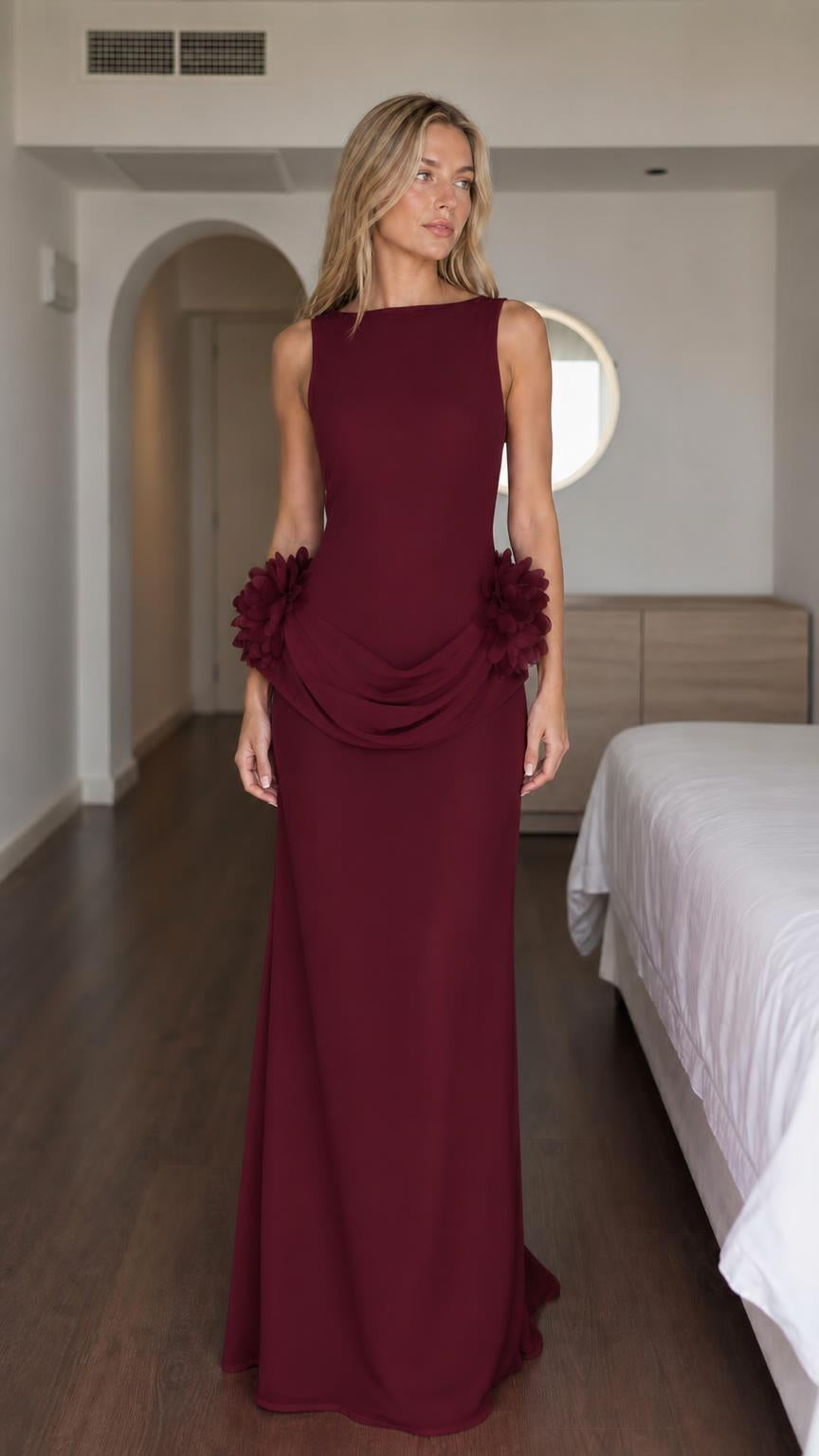 Woman wearing burgundy formal maxi dress with floral details
