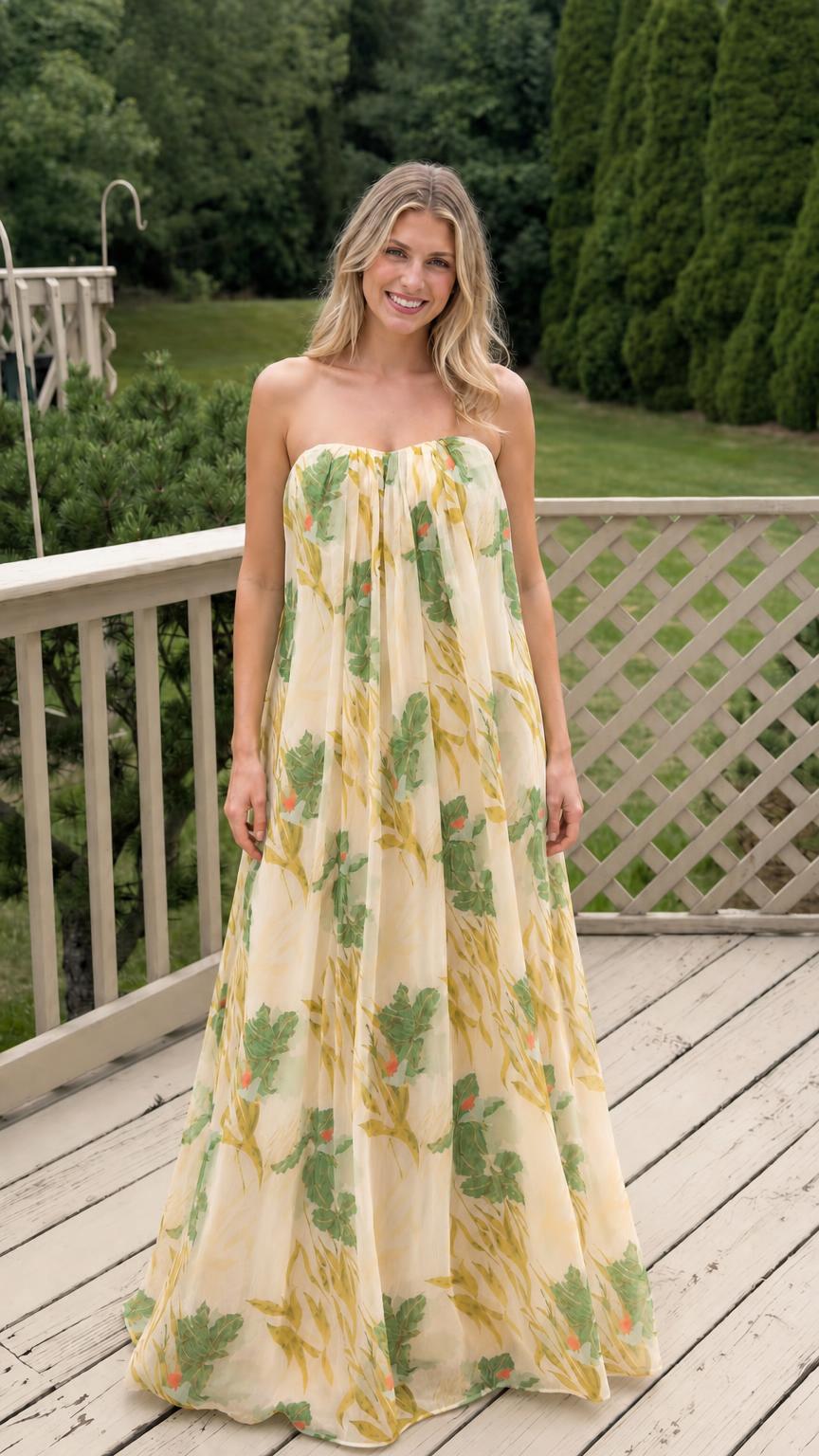 Model wearing yellow floral strapless maxi dress