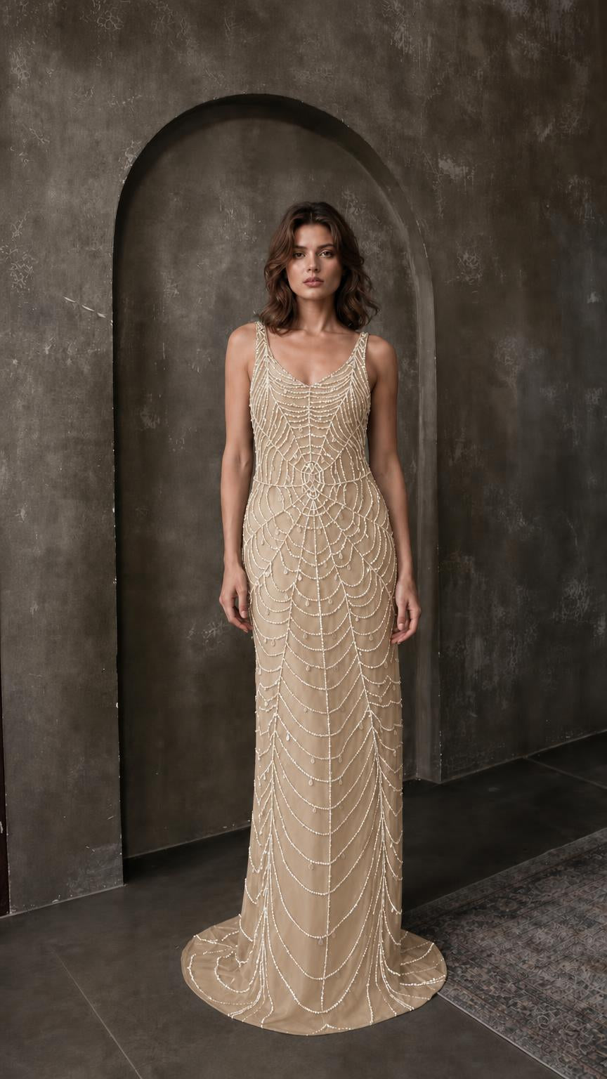 Front view of champagne beaded evening maxi dress
