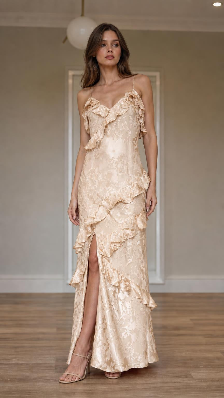 Front view of model wearing champagne ruffled slip maxi dress