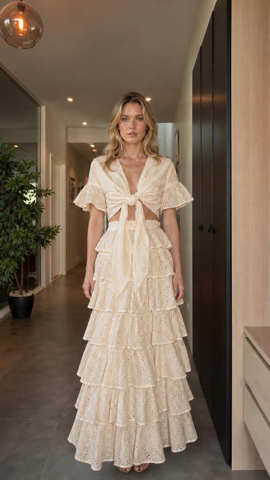 Model wearing beige eyelet embroidered two-piece set