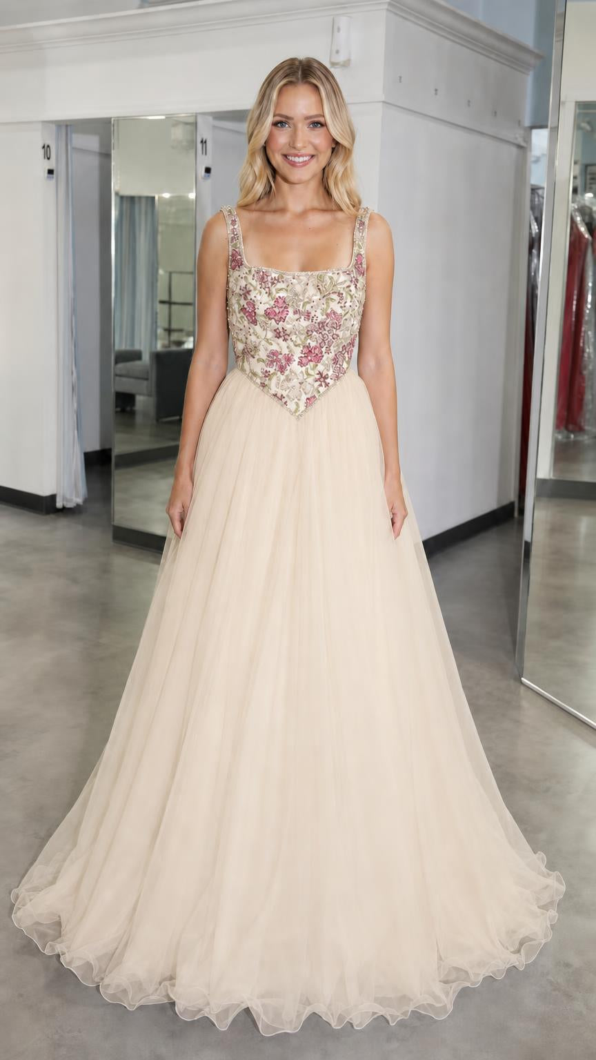 Front view of champagne embroidered bodice tulle ball gown