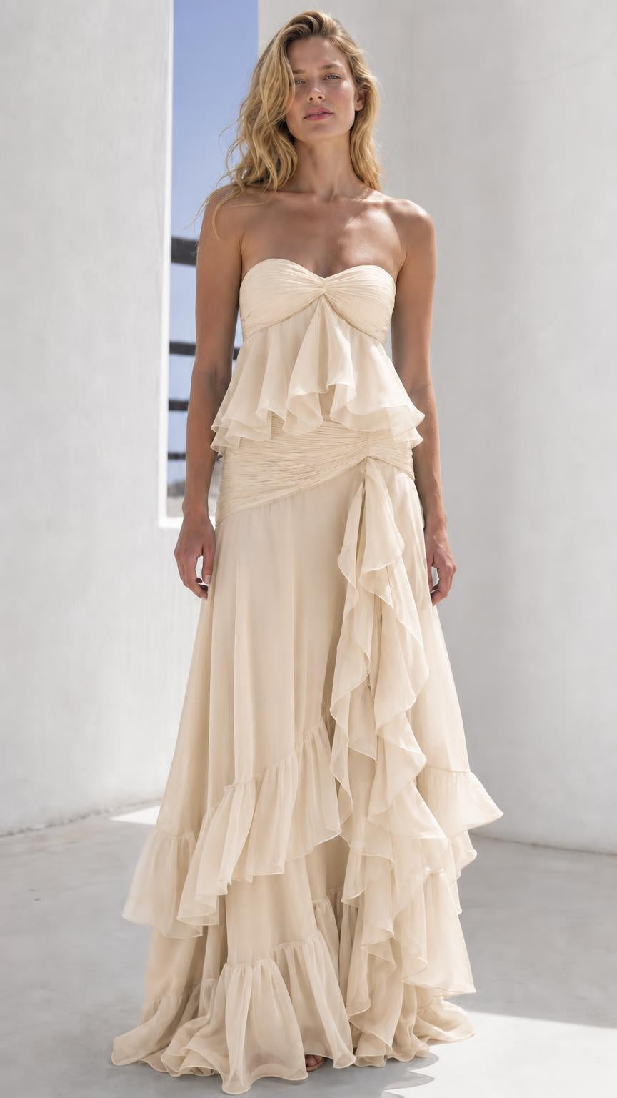 Model wearing champagne strapless tiered maxi dress